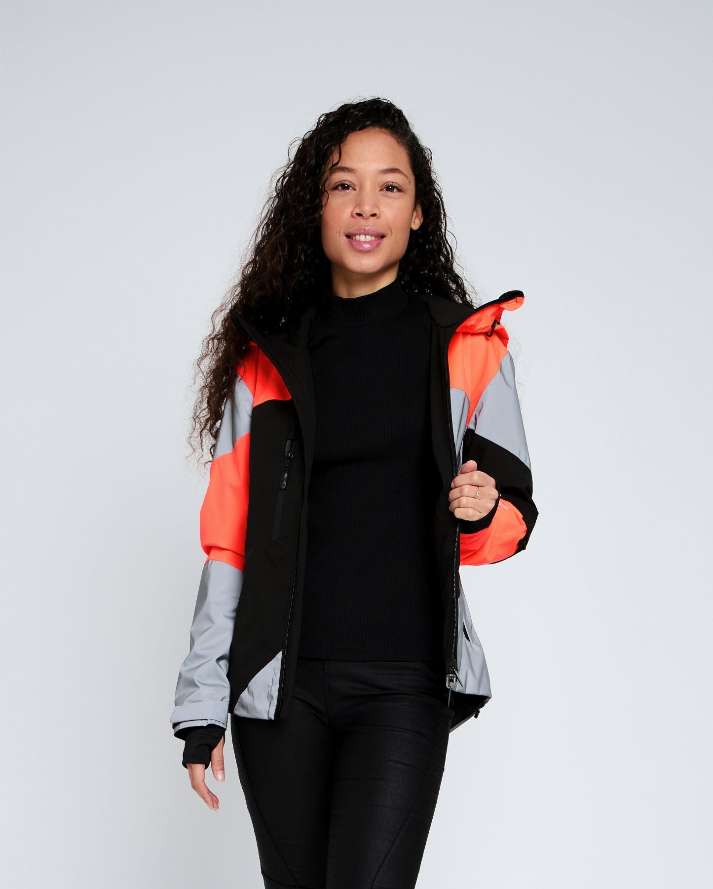 veste imperméable cycliste urbain orange et noire réversible